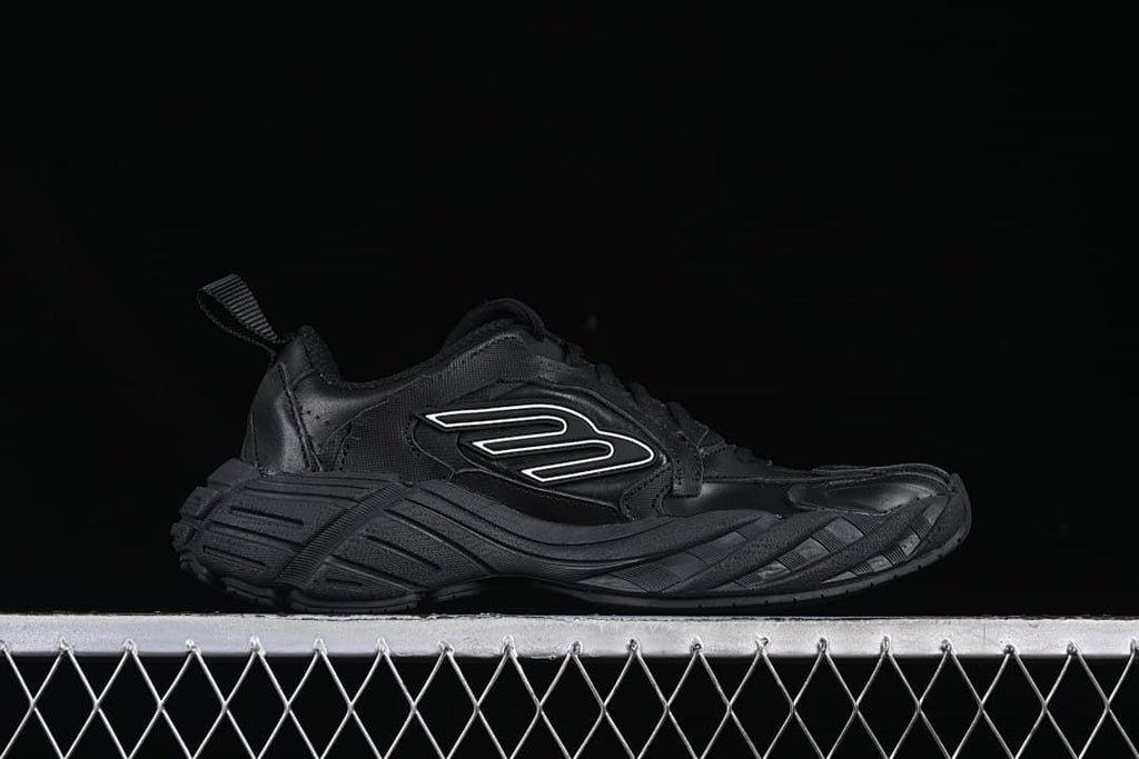Side profile showing the chunky sculpted sole and outlined emblem