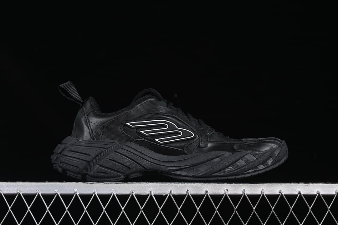 Side profile showing the chunky sculpted sole and outlined emblem