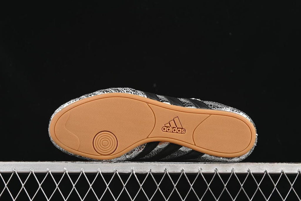 Underside view showing the gum-colored outsole and adidas branding.