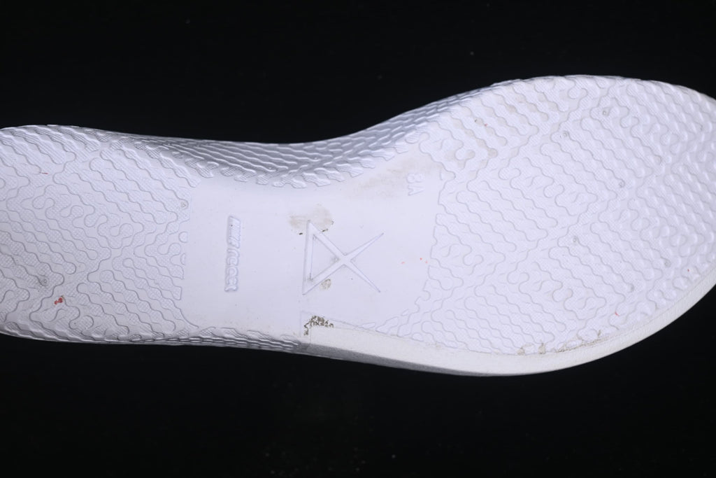 Close-up of the white outsole and its patterned tread