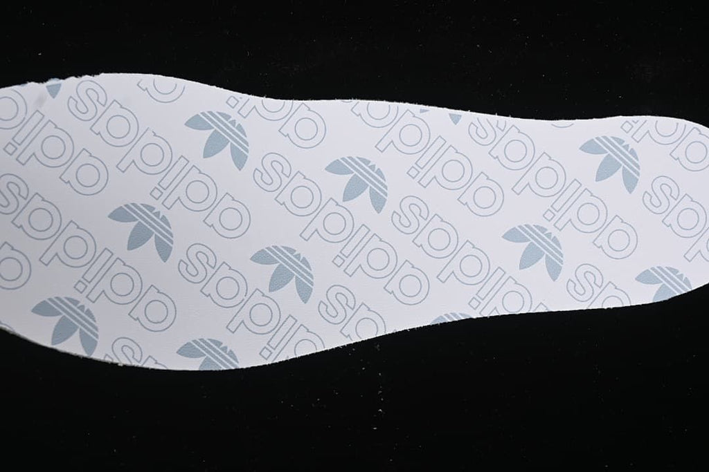 White adidas-branded insole shown separately