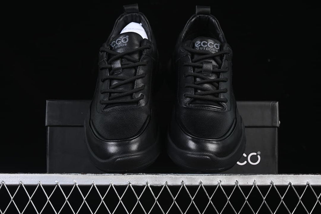 Front view of the pair of black sneakers