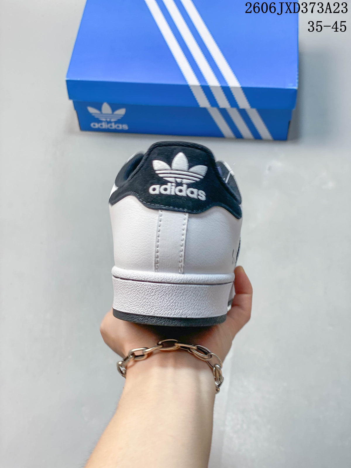 Rear view of the white sneaker with dark heel collar
