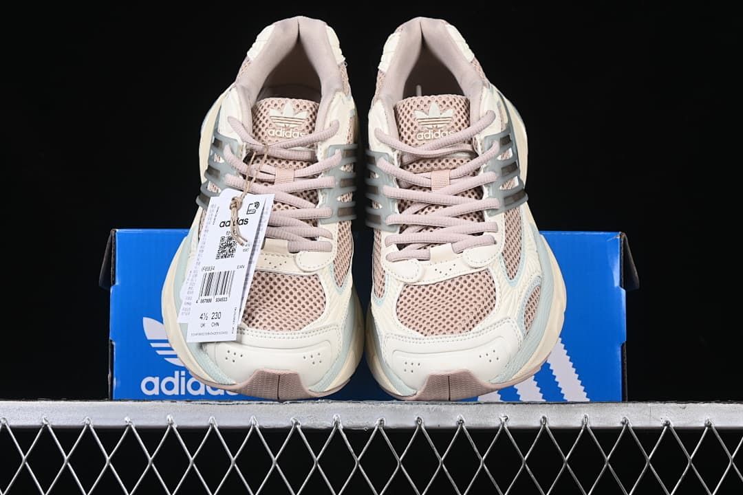 Pair of sneakers displayed on an Adidas shoe box