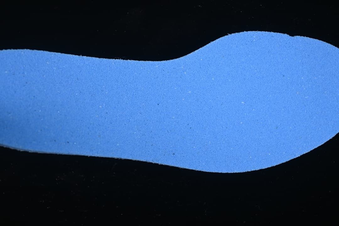 Blue shoe insole shown separately