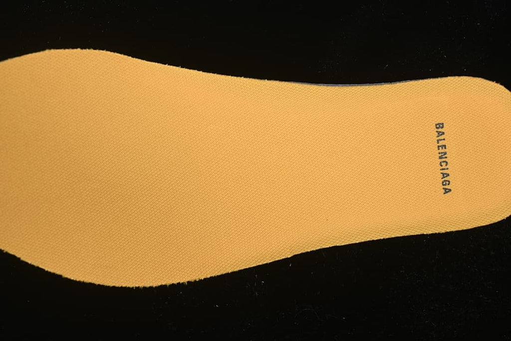 Orange insole with Balenciaga text