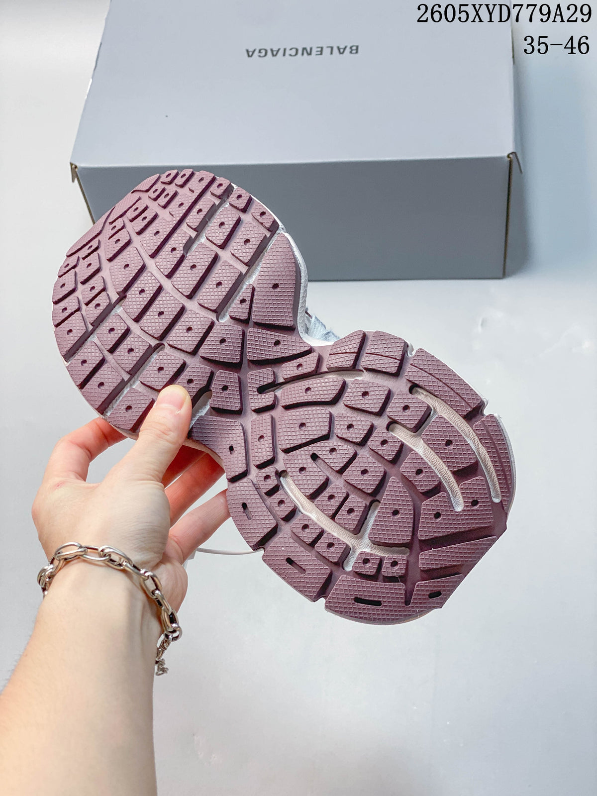Close-up of the burgundy patterned outsole on a Balenciaga Phantom sneaker.