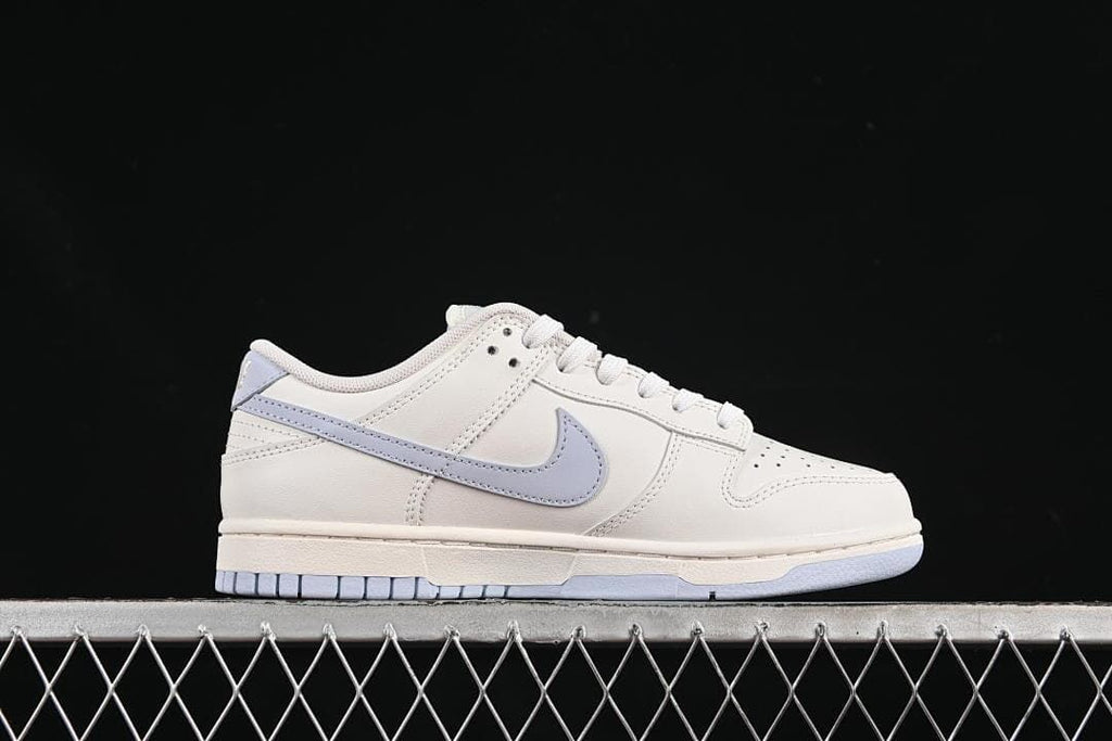 Side profile of the sneaker highlighting the light blue Swoosh