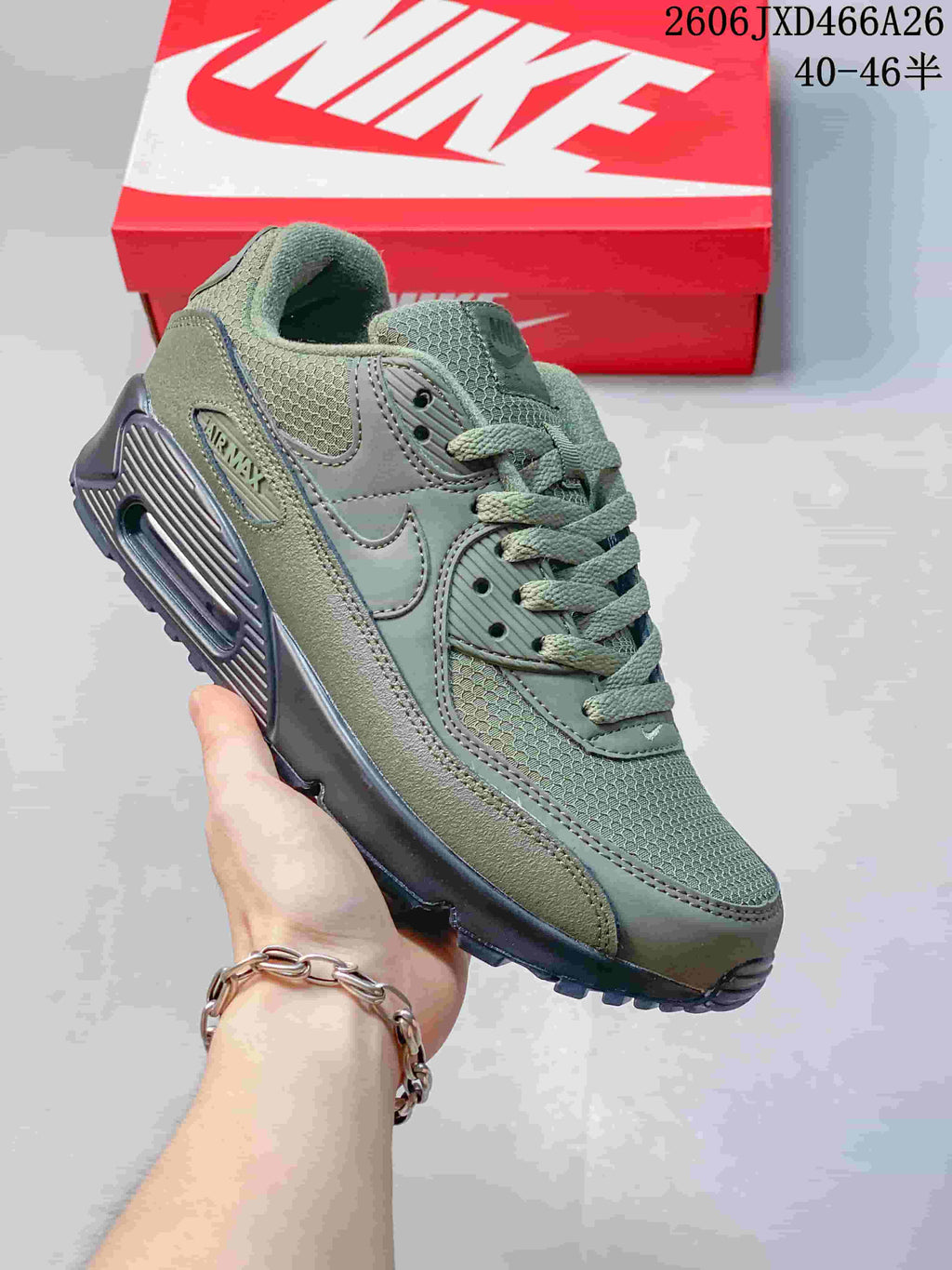 Olive green Nike Air Max 90 sneaker with a dark outsole