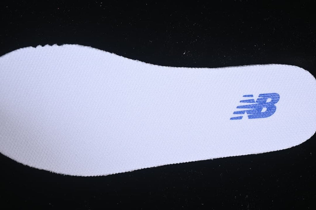White insole with a blue New Balance logo.