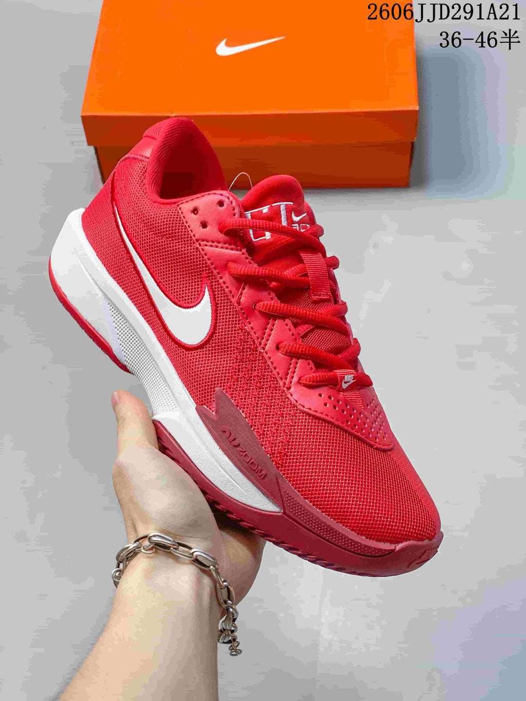 Red Nike G.T. Cut 3 basketball shoe with a white Swoosh and white midsole section.