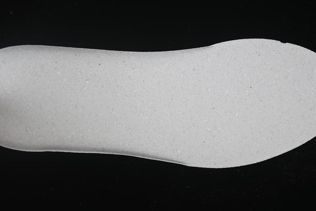 Close-up view of the shoe's light-colored insole.