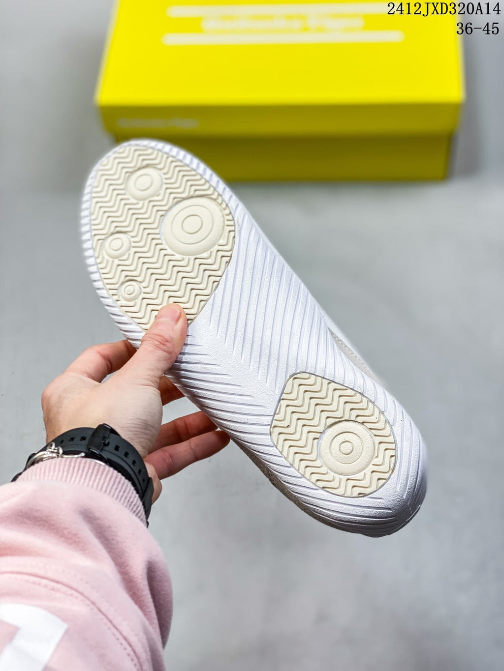 Underside of a sneaker showing its patterned tread
