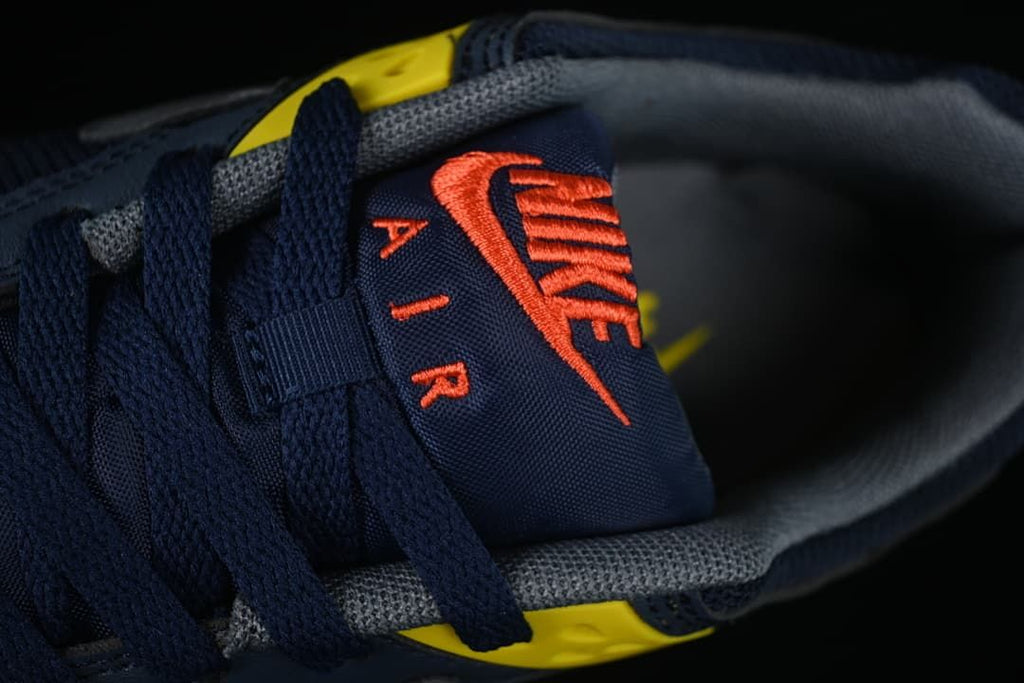 Close-up of the tongue branding and navy laces.