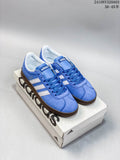 Pair of blue Adidas neo VL Court 2.0 sneakers with white stripes and dark brown outsoles