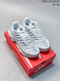 White and blue Nike Air Max 95 sneakers displayed on a red shoe box.