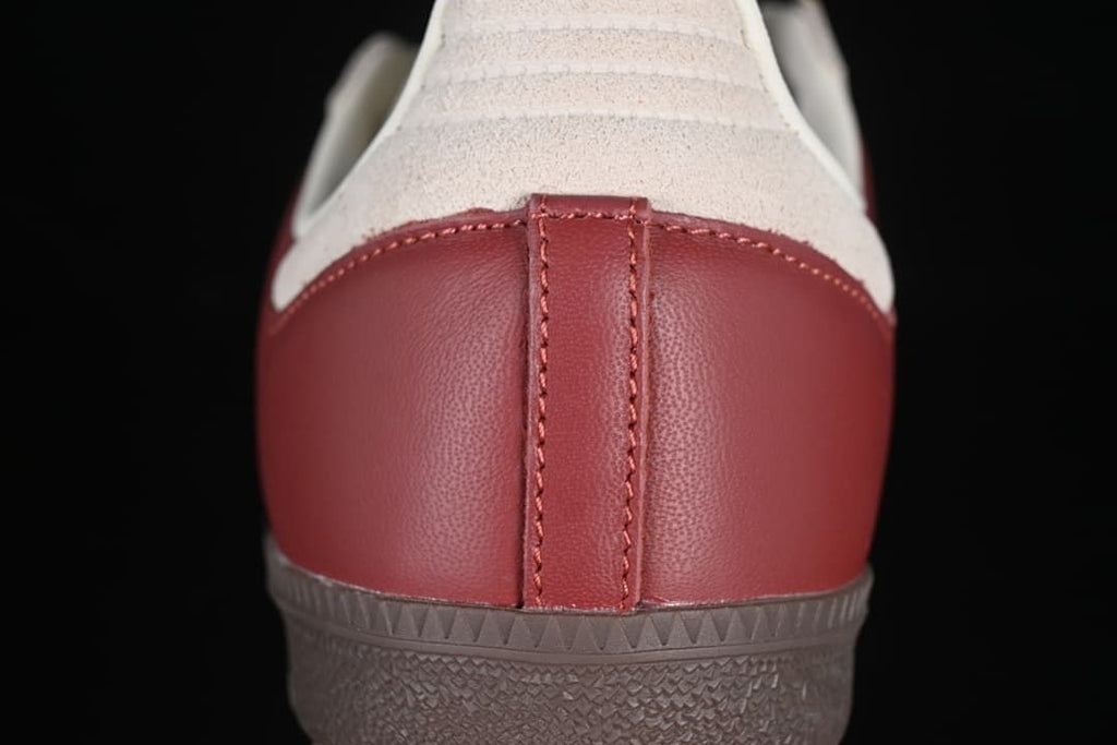 Close-up of the burgundy heel panel and cream heel overlay