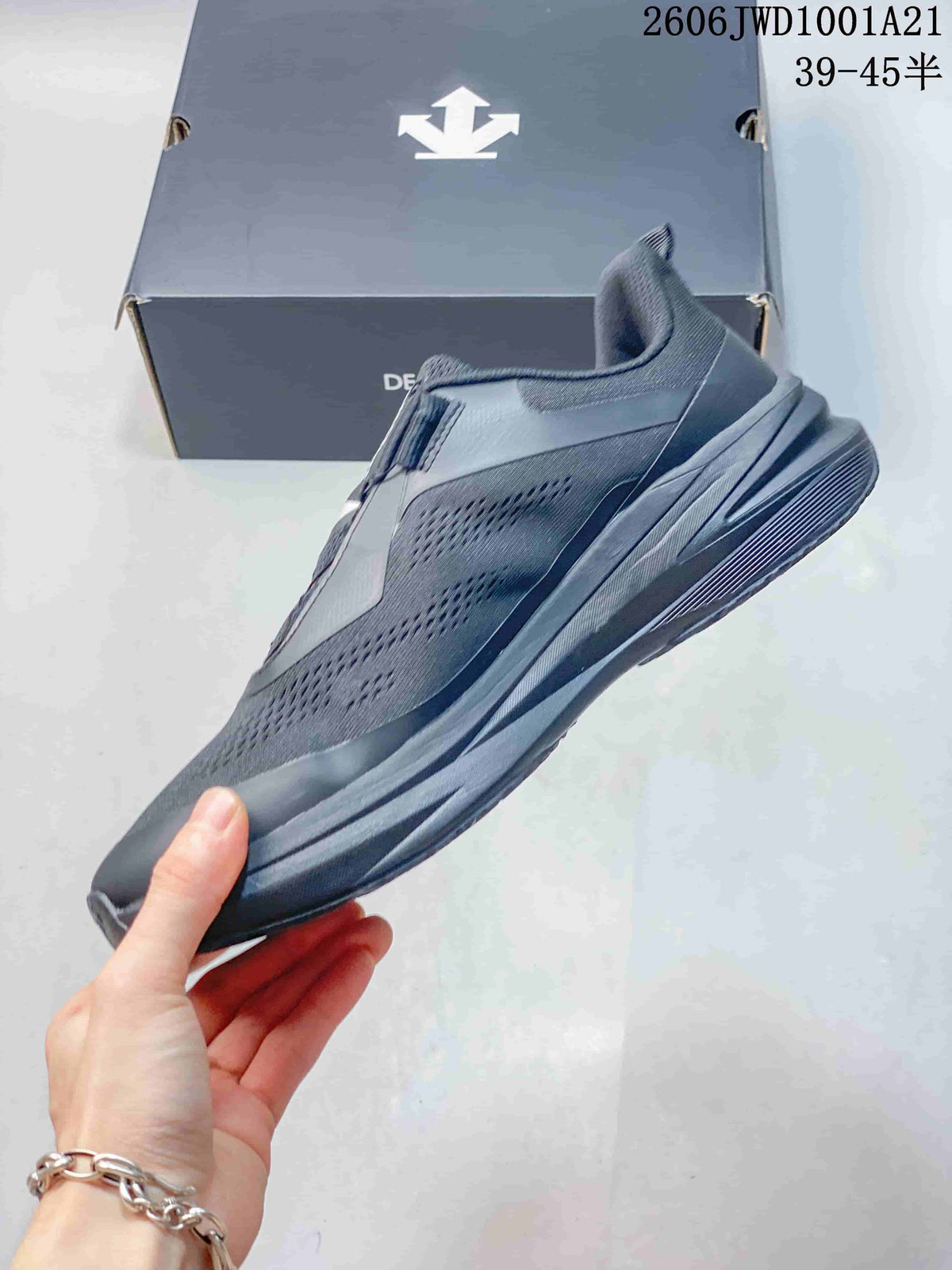 Side profile of a dark gray low-top sneaker with textured upper and sculpted midsole