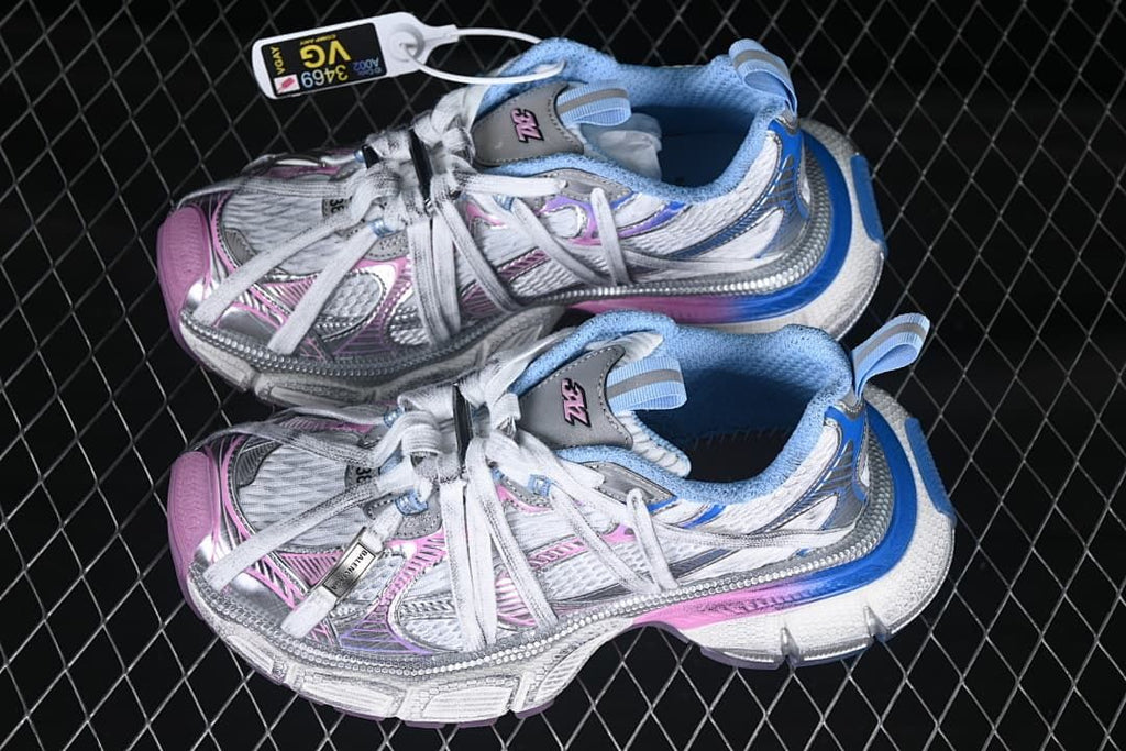 Pair of white, silver-toned, pink and blue sneakers shown from above