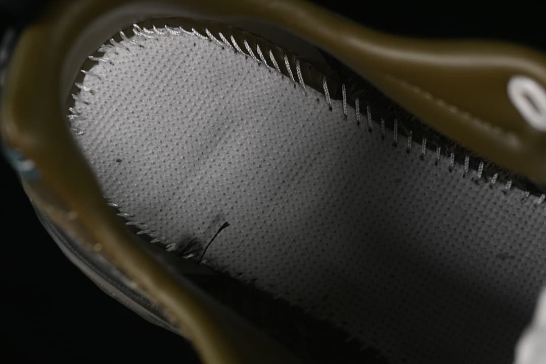 Close-up inside the sneaker showing the lining and stitching.