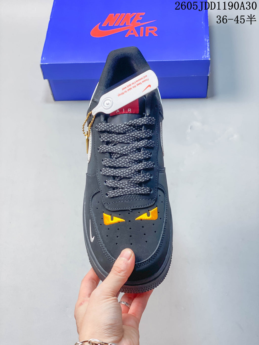 Top view showing patterned laces and yellow graphics on the perforated toe.