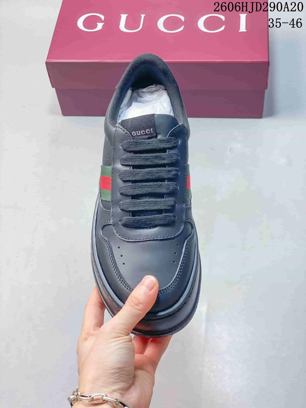 Top view showing the rounded toe, laces, and green-and-red side stripe