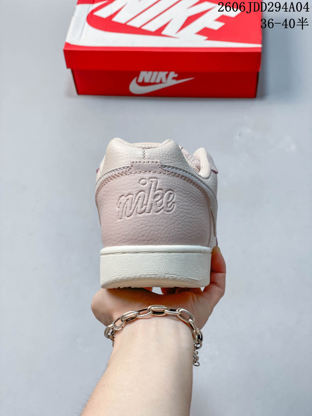 Rear view showing the sneaker's heel panel and low-profile sole.
