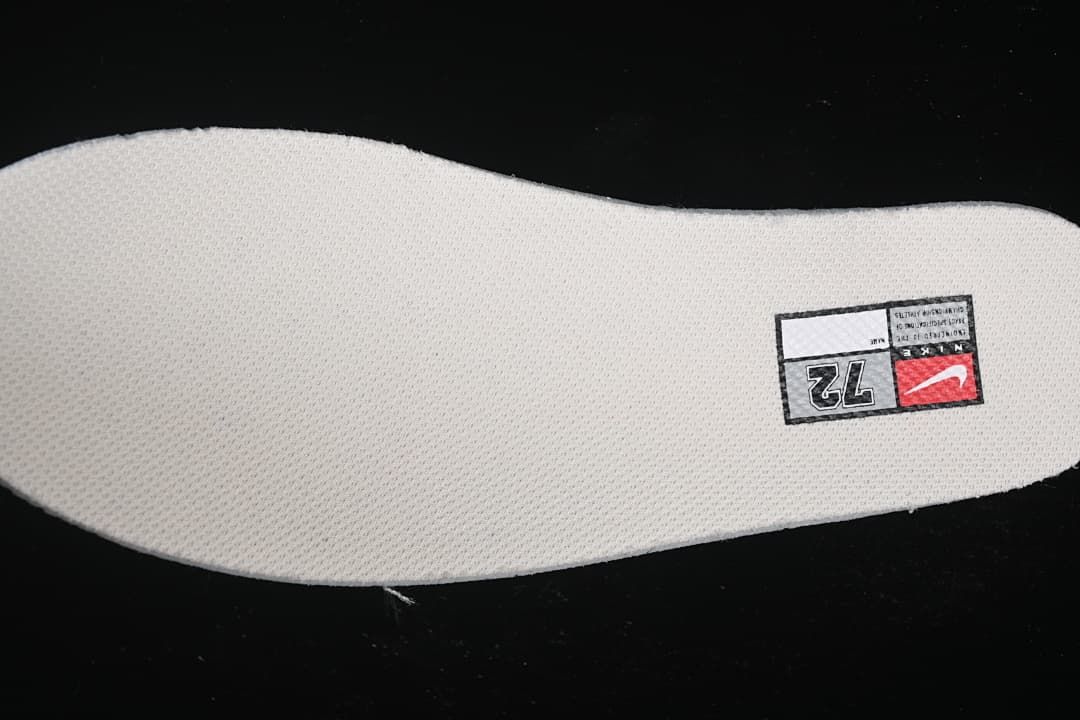 Close-up of a shoe insole with a size label marked 72