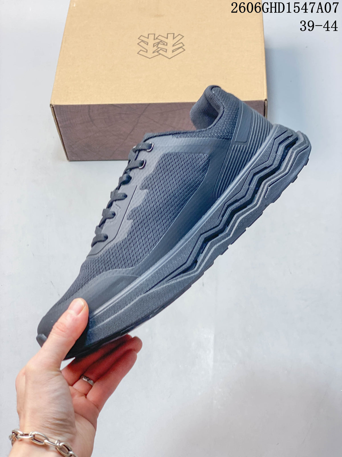 Side view of the dark gray lace-up sneaker