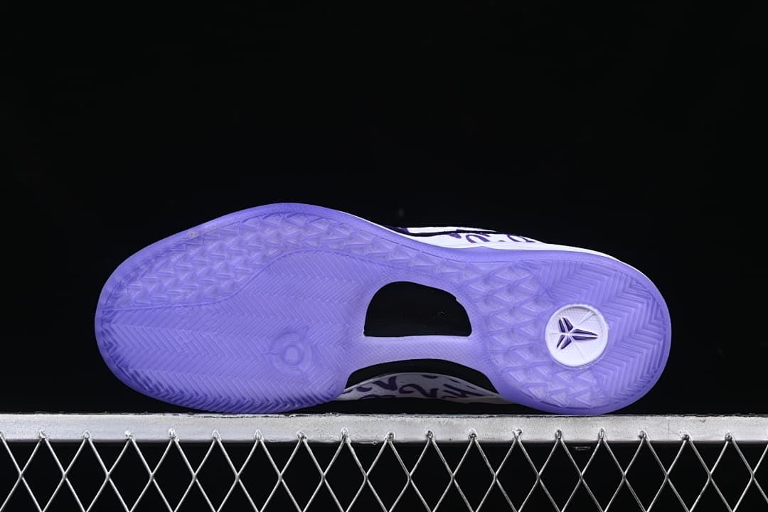 Purple outsole with patterned tread and central cutout