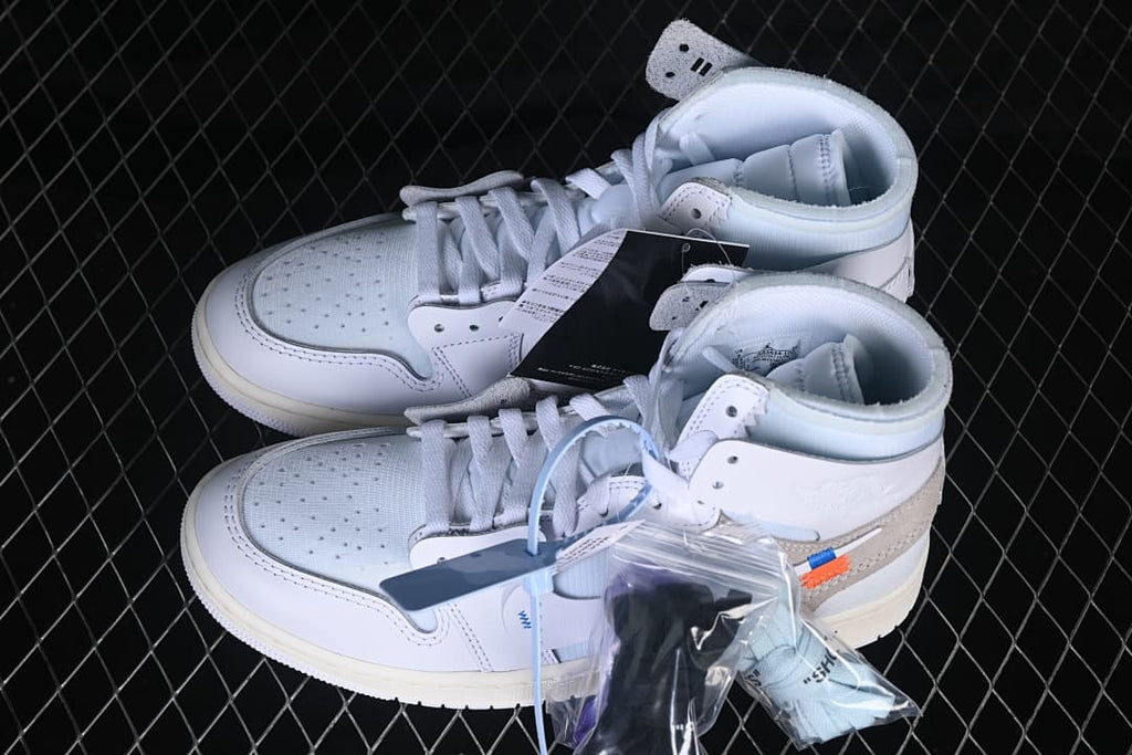 Pair of white high-top Air Jordan 1 sneakers with extra laces shown
