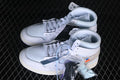 Pair of white high-top Air Jordan 1 sneakers with extra laces shown