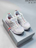White ASICS GT-2160 sneakers with silver-gray overlays and red, white, and navy accents, shown from the front