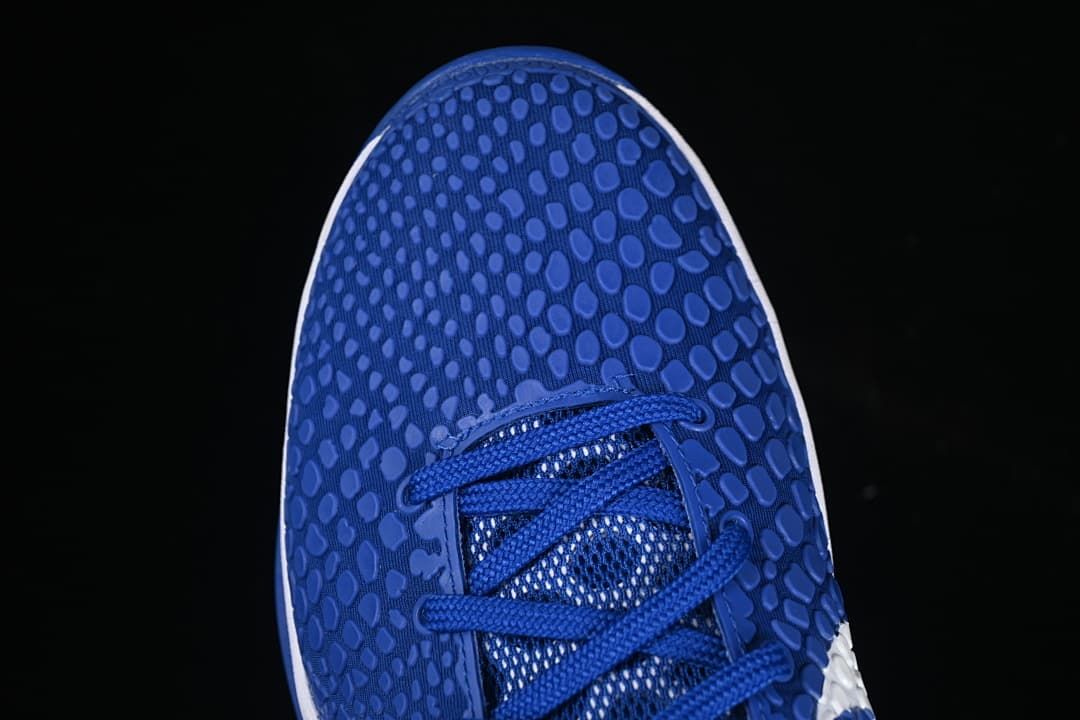 Top-down close-up of the patterned blue toe and laces