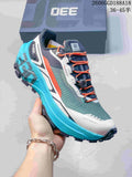 Kailas FUGA EX330 trail shoe in gray, orange, white, and turquoise, with quick lacing and a lugged sole