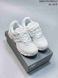 White New Balance 1954R sneakers shown from above on a shoe box