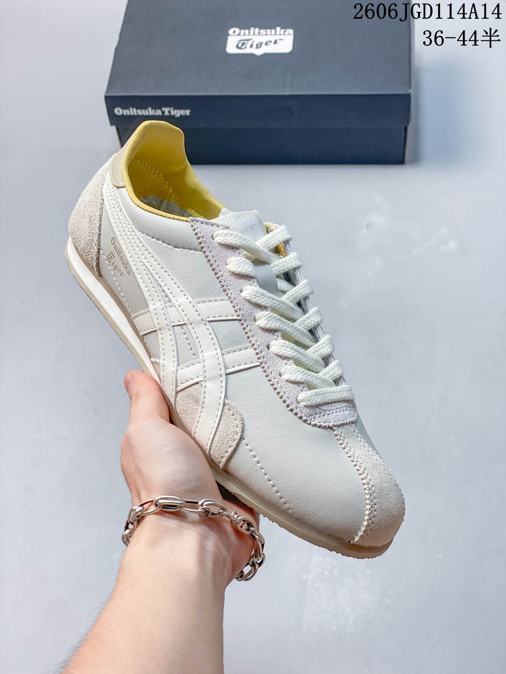 Angled side view highlighting the layered stripes and textured toe panel