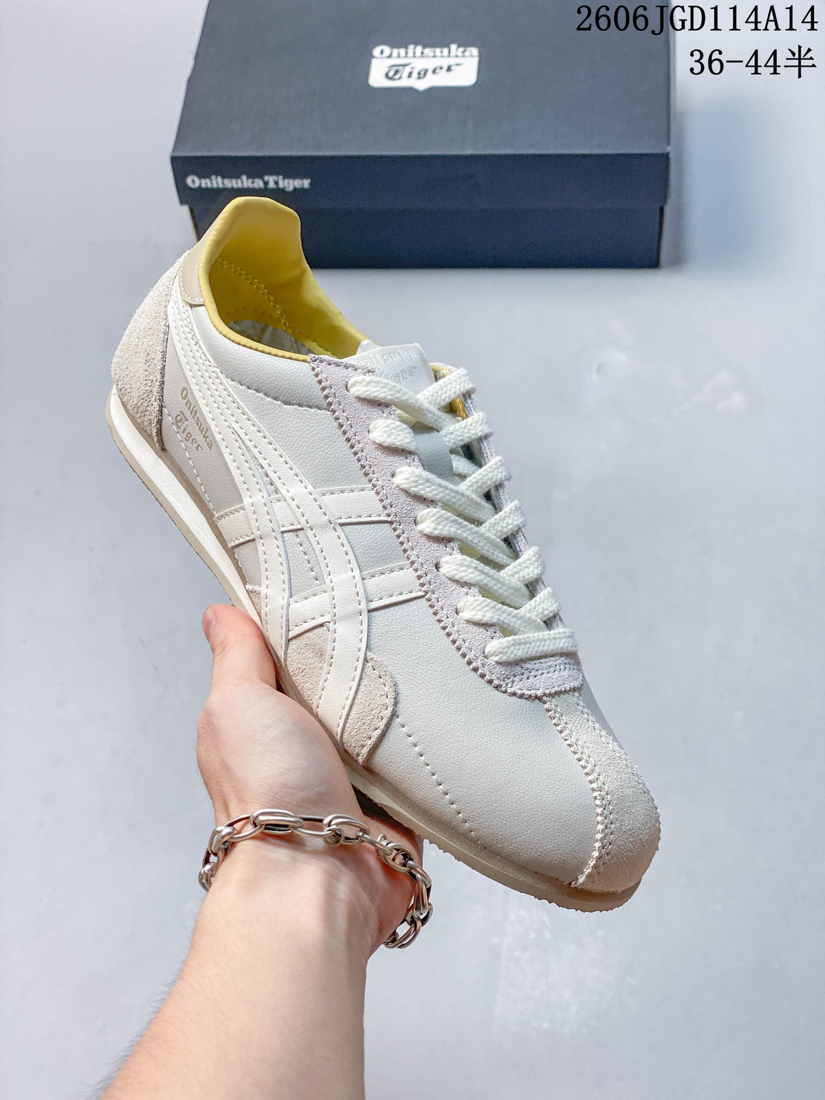 Angled side view highlighting the layered stripes and textured toe panel
