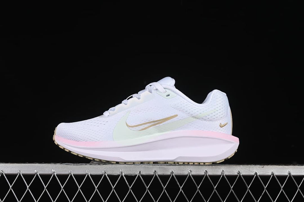 Side profile of white Nike Winflo 11 with pastel accents