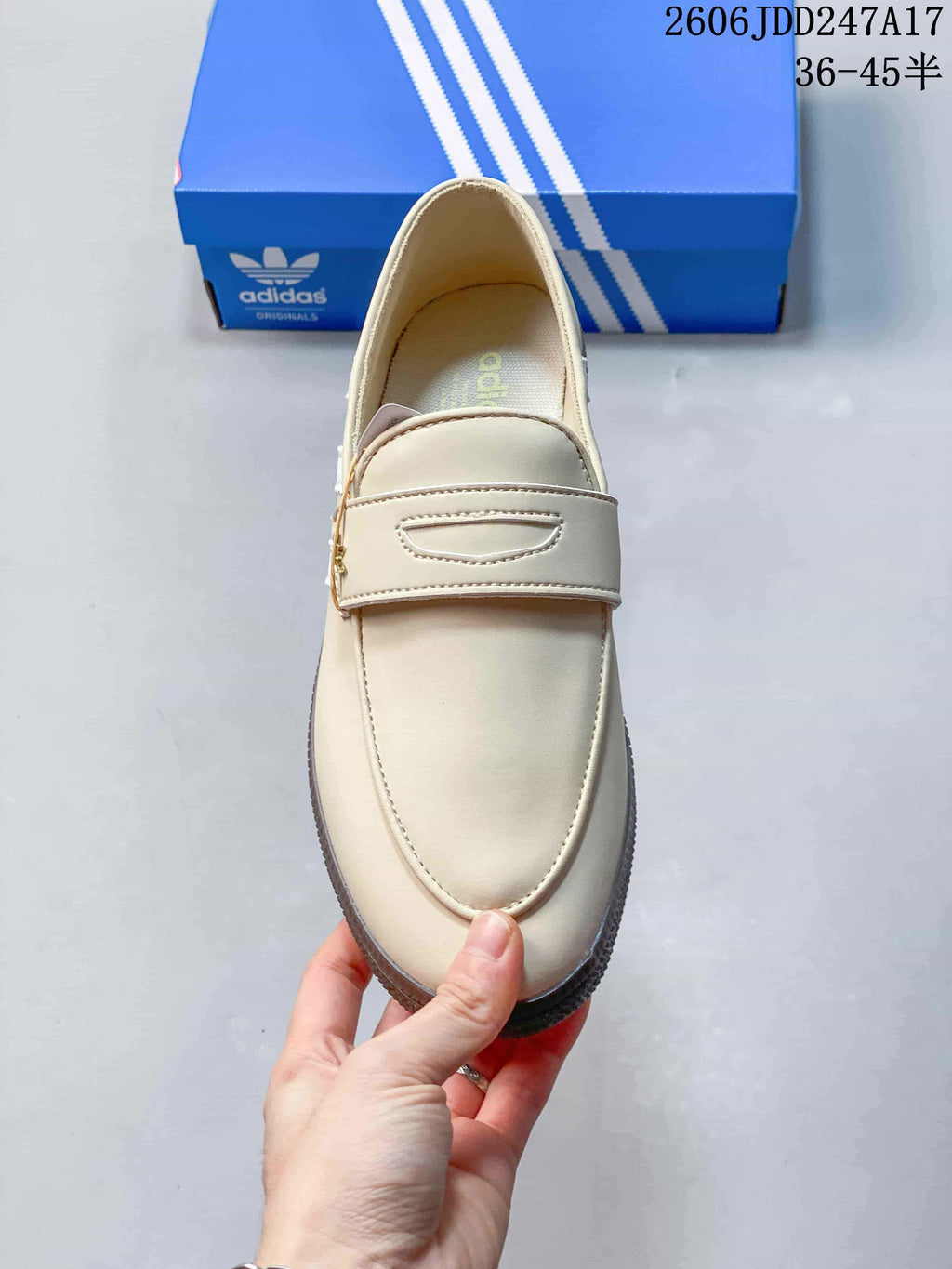 Top view of a cream adidas Handball Spezial shoe with a broad instep strap