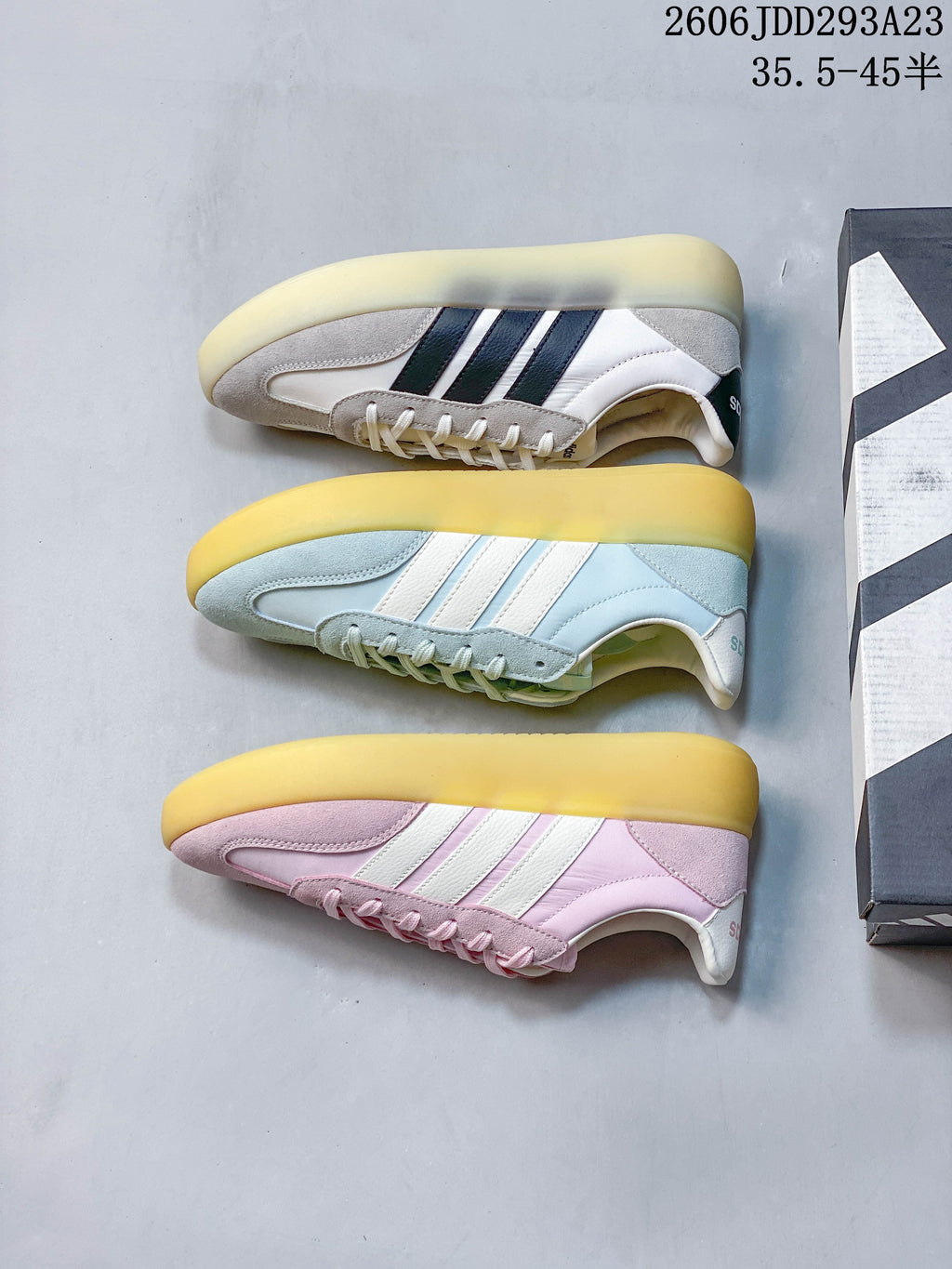 Three Adidas Barreda Decode colorways shown from the side: white and gray, pale blue, and pink.