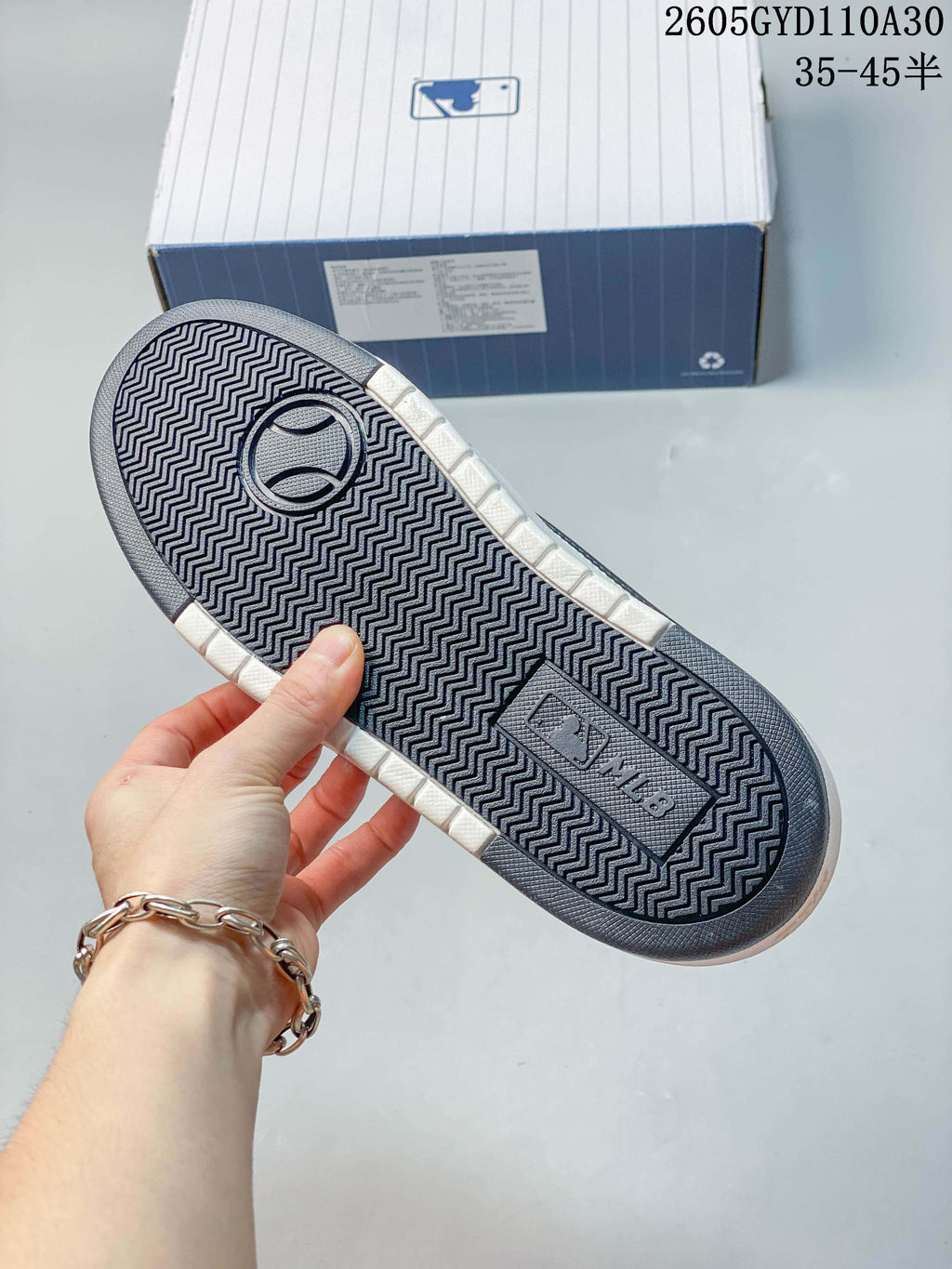 Close-up of the sneaker outsole showing its patterned tread