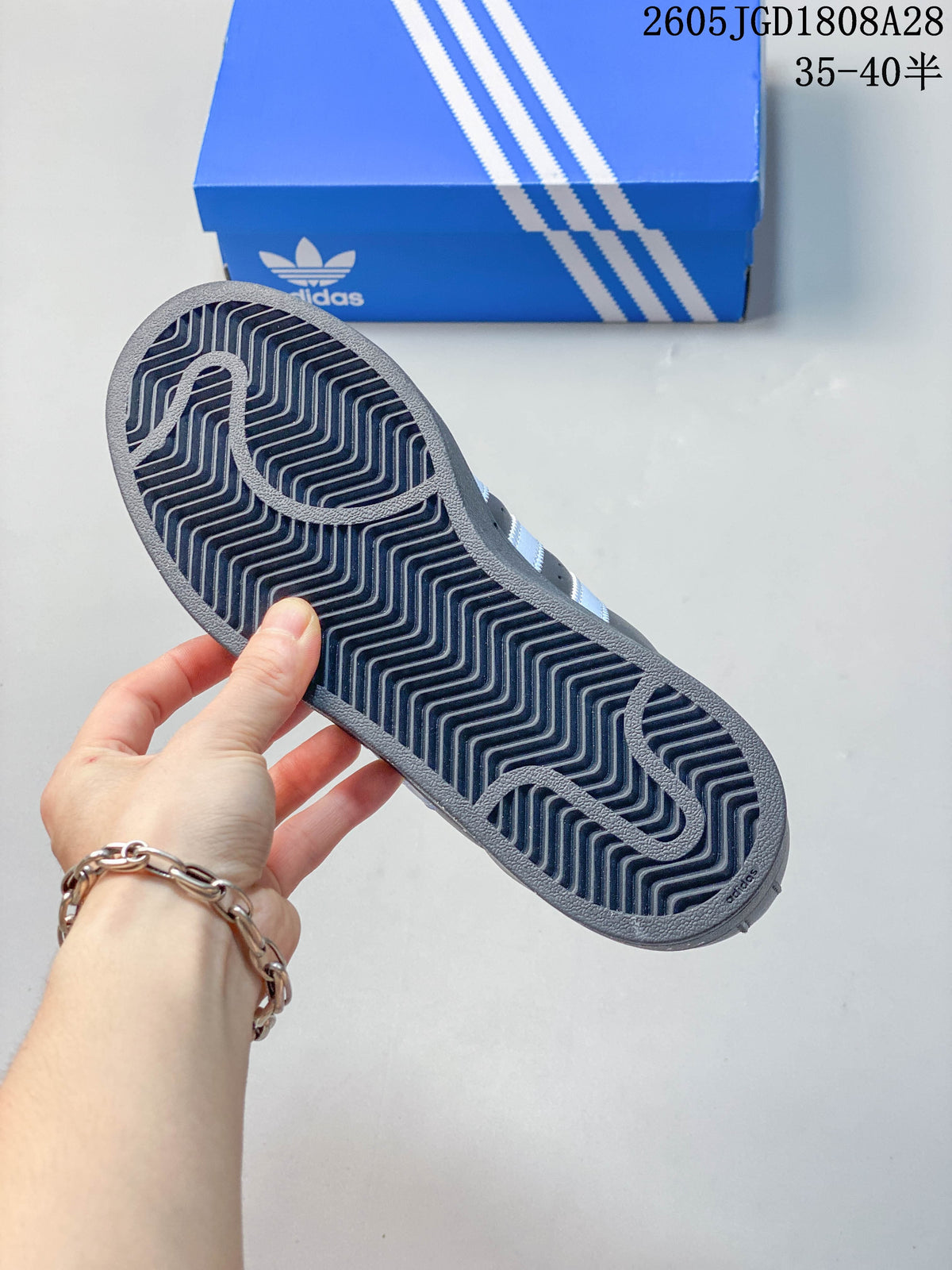 Close-up of the sneaker outsole showing a patterned tread