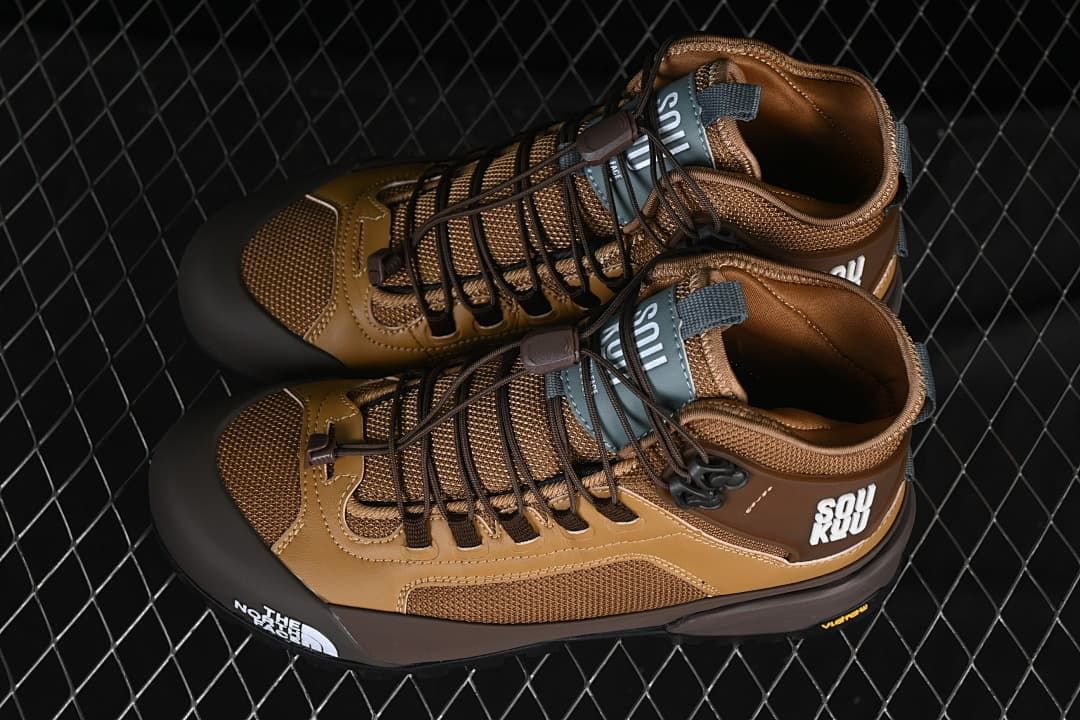 Pair of brown mid hiking shoes photographed from above