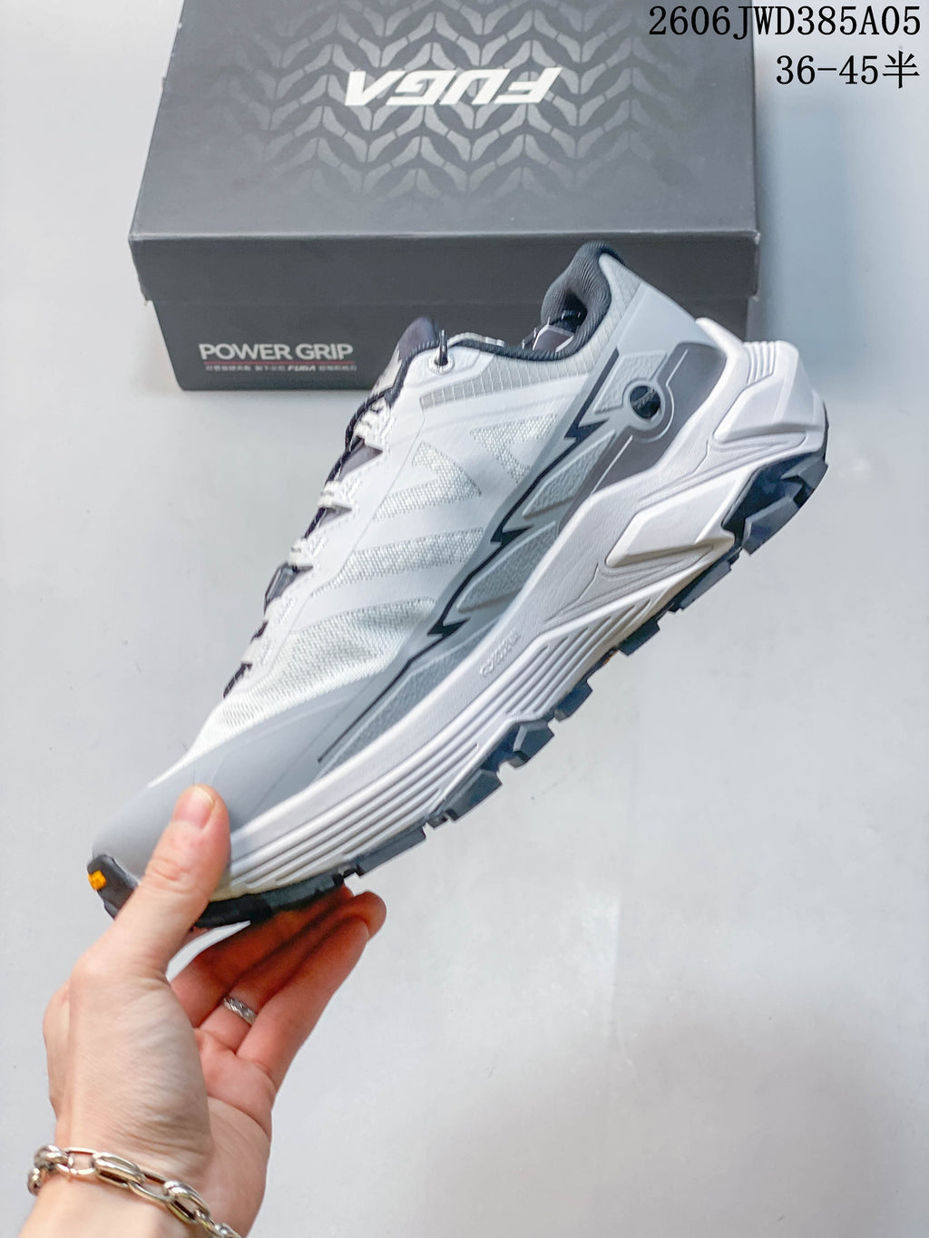 Side view of the gray and white Kailas Fuga Ex3 trail running shoe