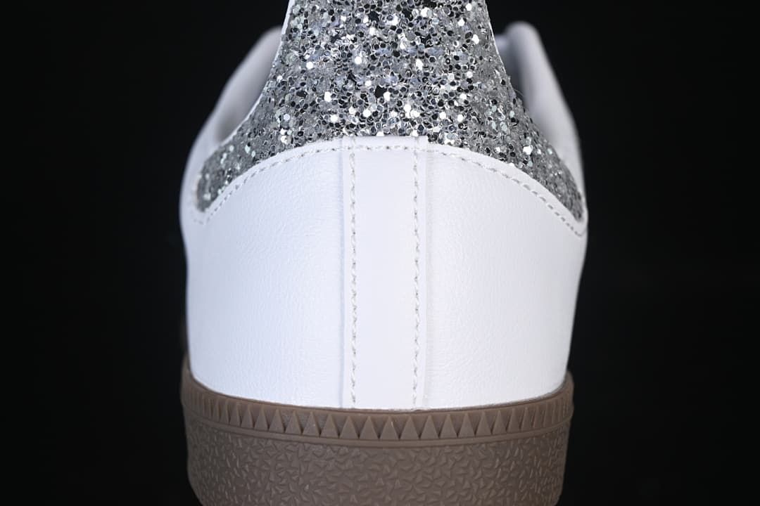 Rear view highlighting the silver glitter-effect heel panel and gum-brown outsole.