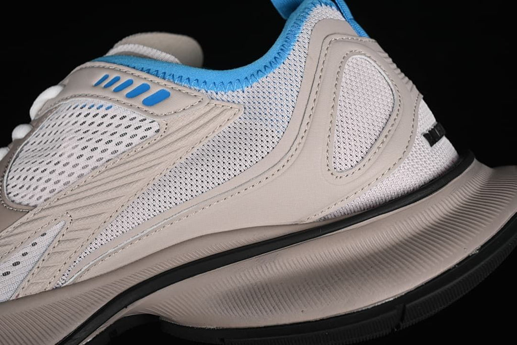 Close-up of mesh panels, layered overlays, and sculpted sole