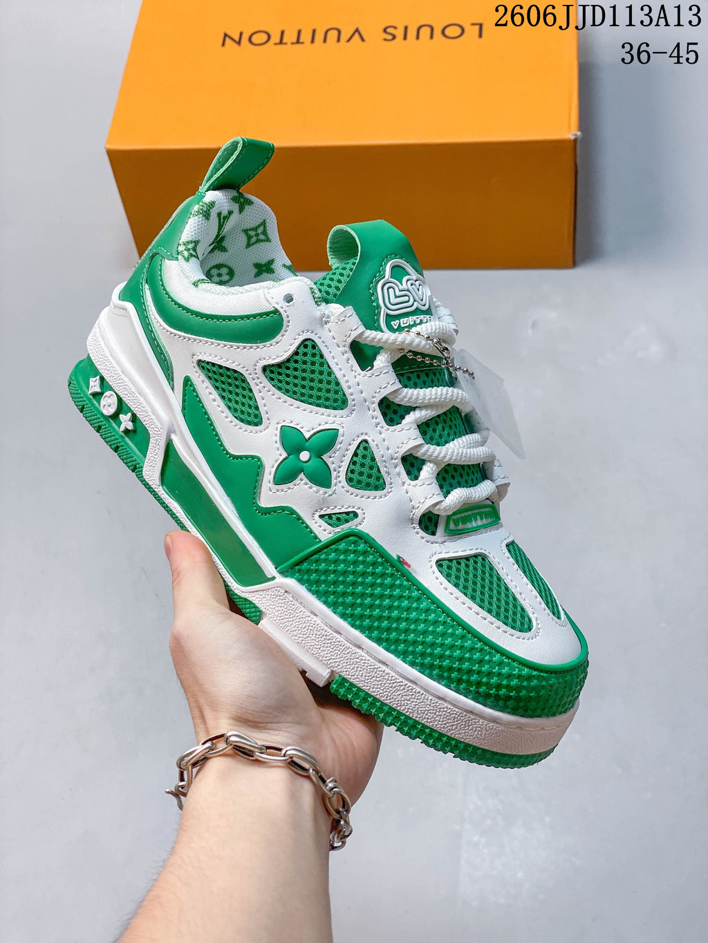 Angled side view highlighting the green and white panels and decorative motifs.