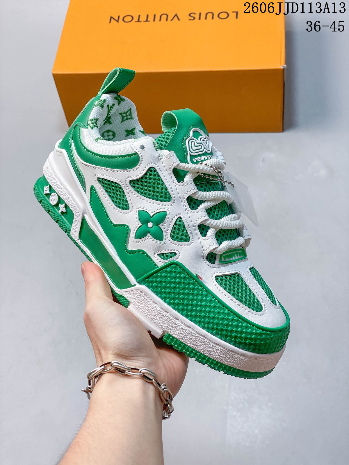 Angled side view highlighting the green and white panels and decorative motifs.