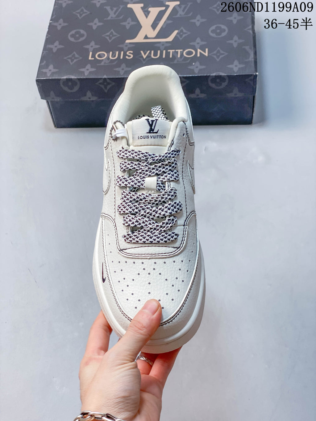 Top view showing patterned laces and a perforated toe panel